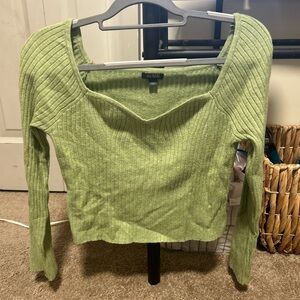 Light green long sleeve top. slightly cropped